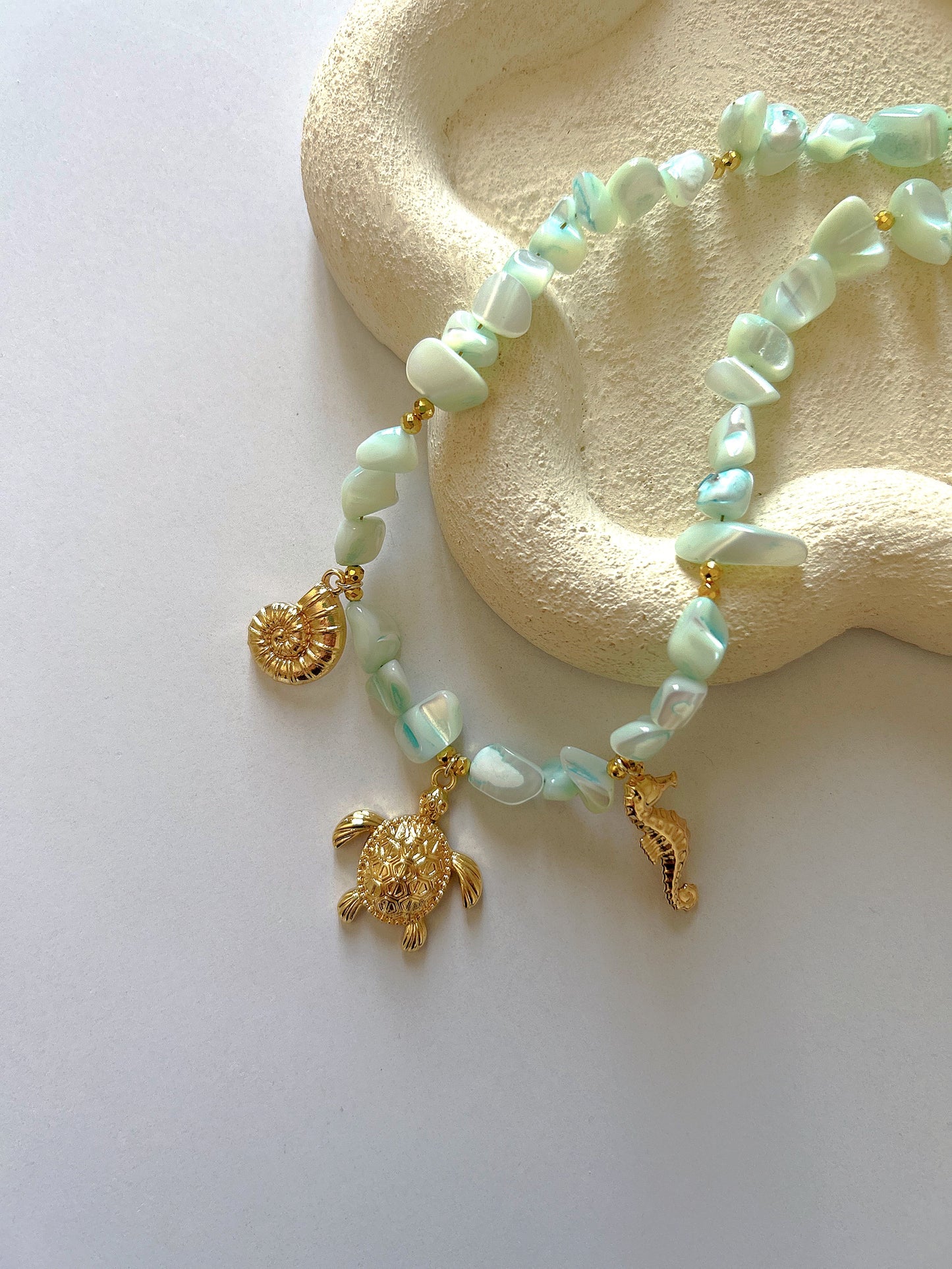 Charms necklace with green stones
