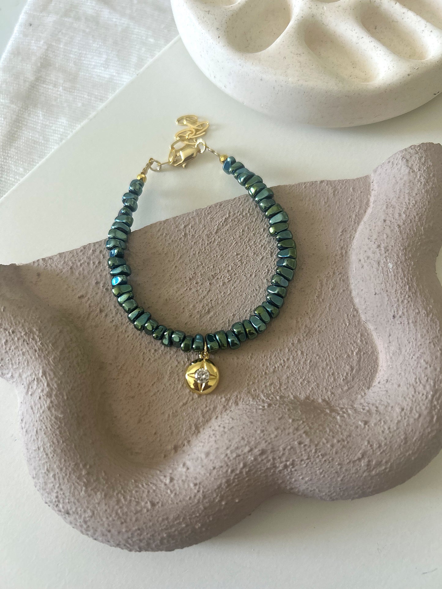 Green stone bracelet (golden charm)