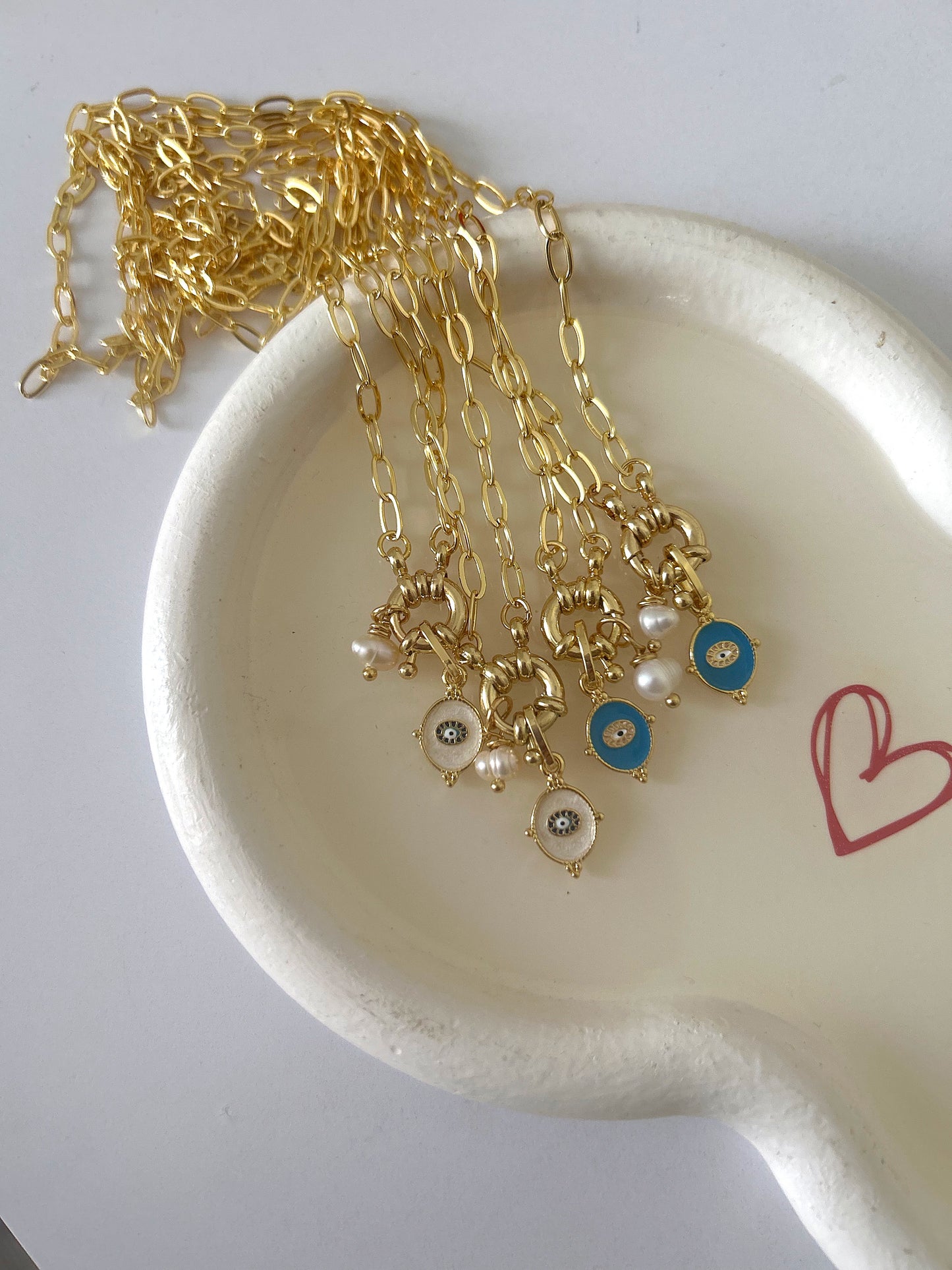 Golden necklace with tiny charm