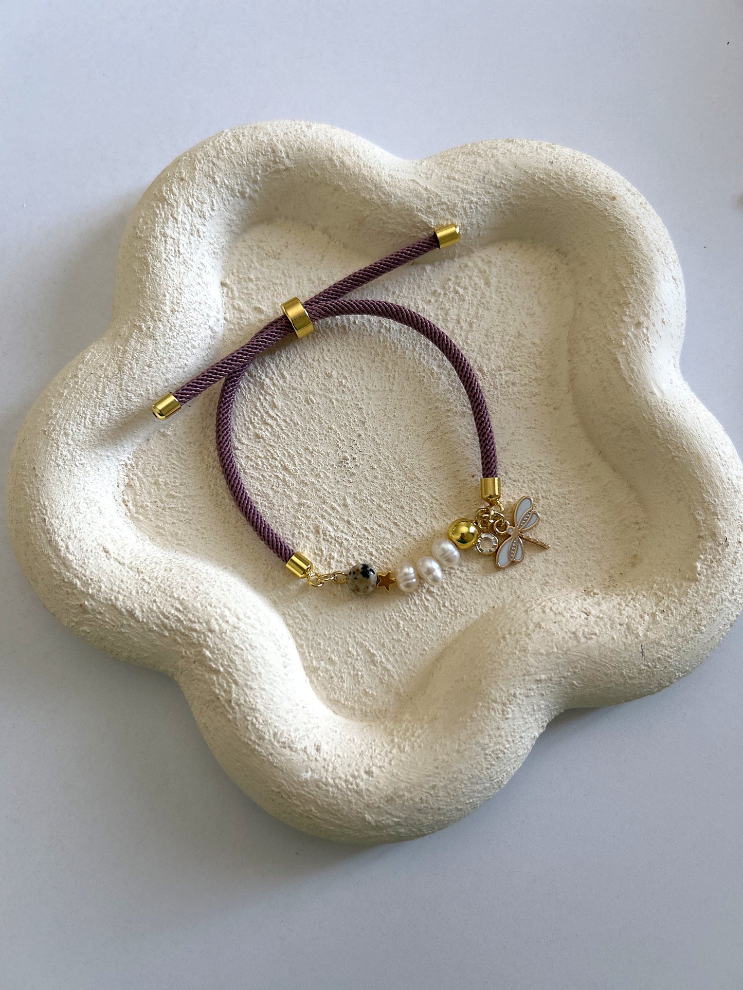 Pearls bracelet with butterfly charm