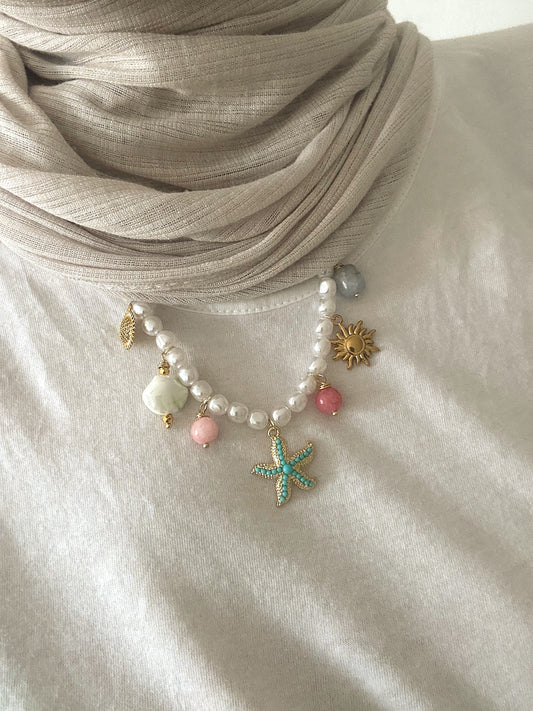 Blue star in pearly necklace